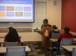 : Dr. Nikki Wooten, coordinator for the Graduate Certificate in Social and Behavioral Health with Military Members, Veterans and Military Families, teaches her “Military Mental Health and the Impact of Trauma” class